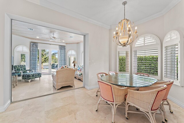 dining space featuring crown molding and ceiling fan with notable chandelier