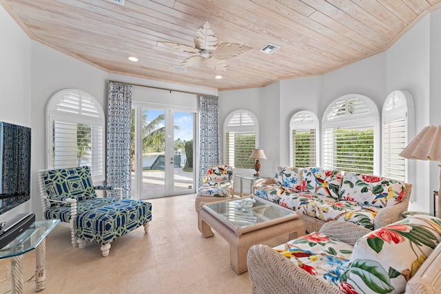 living room featuring ceiling fan, french doors, and wooden ceiling