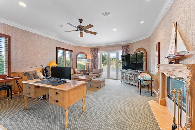 office area with a premium fireplace, french doors, ceiling fan, and ornamental molding