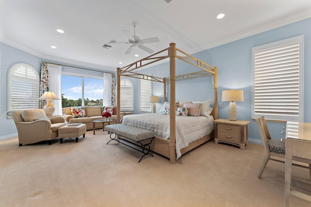 carpeted bedroom with ceiling fan and ornamental molding