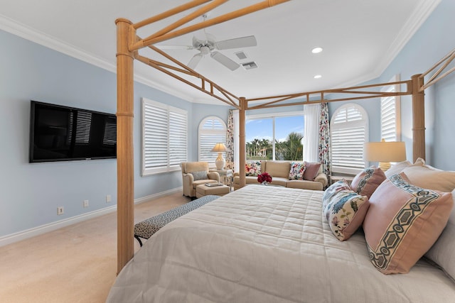 carpeted bedroom with ceiling fan and ornamental molding