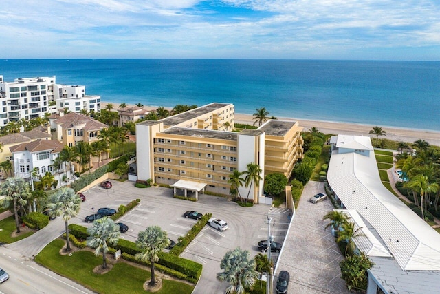 aerial view featuring a water view and a beach view