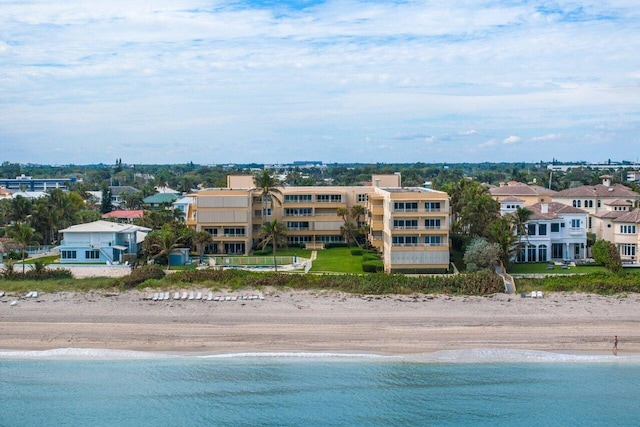 aerial view with a water view and a beach view