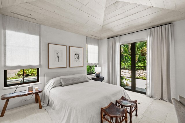 bedroom with access to exterior, wood ceiling, and multiple windows