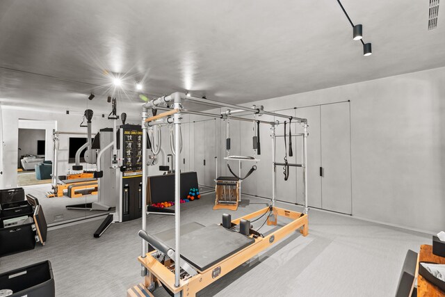 exercise area with carpet floors