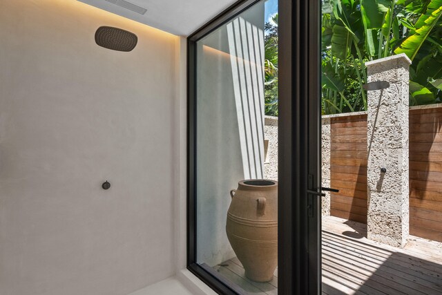 doorway with hardwood / wood-style floors