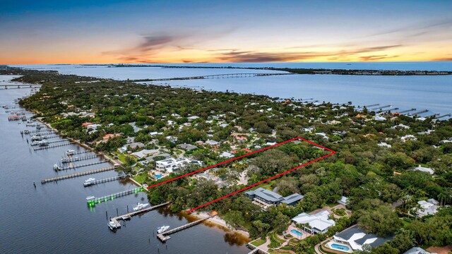 aerial view at dusk with a water view