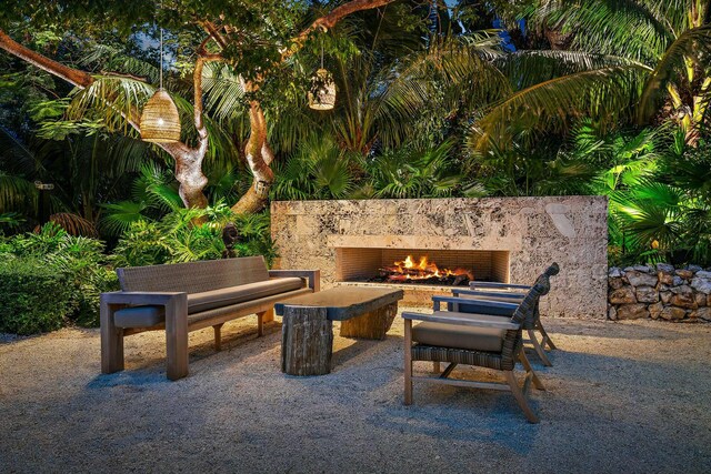 view of patio / terrace featuring an outdoor fireplace