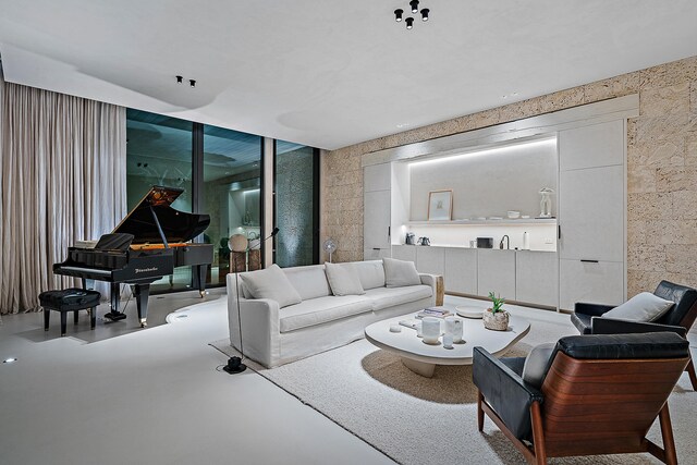 living room featuring concrete flooring