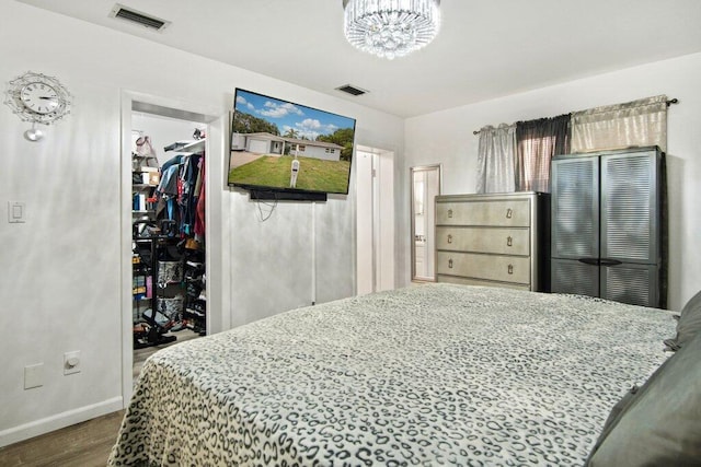 bedroom featuring hardwood / wood-style floors and a closet