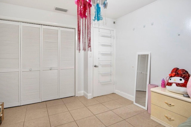 unfurnished bedroom featuring light tile patterned flooring