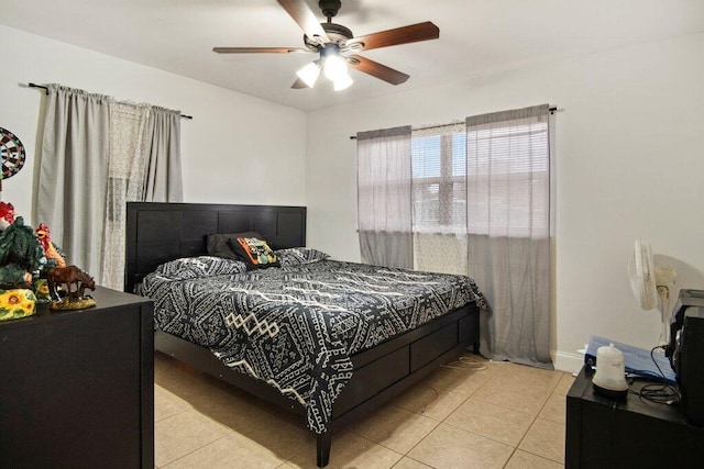 tiled bedroom with ceiling fan