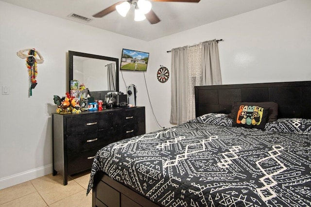 bedroom with ceiling fan and light tile patterned flooring