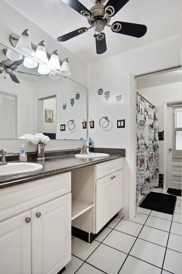 bathroom with tile patterned flooring, vanity, a shower with shower curtain, and ceiling fan