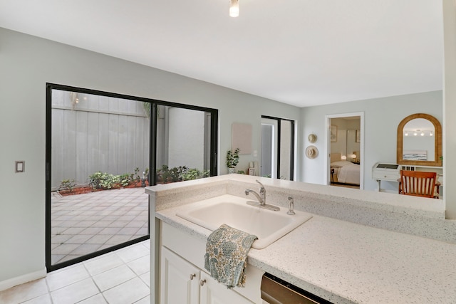 bathroom with tile patterned flooring and vanity