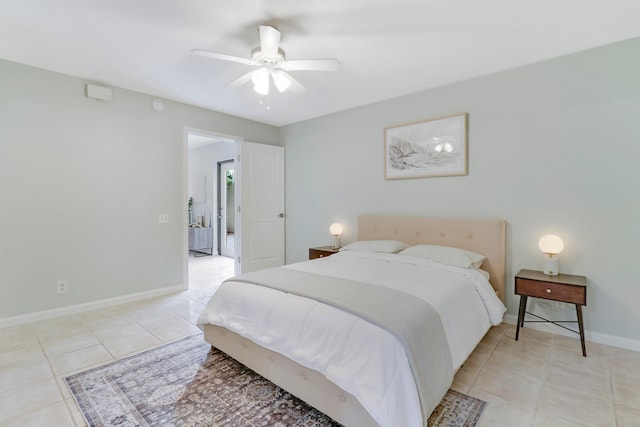 tiled bedroom featuring ceiling fan