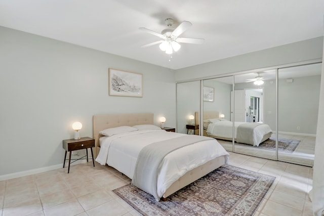 tiled bedroom featuring ceiling fan and a closet