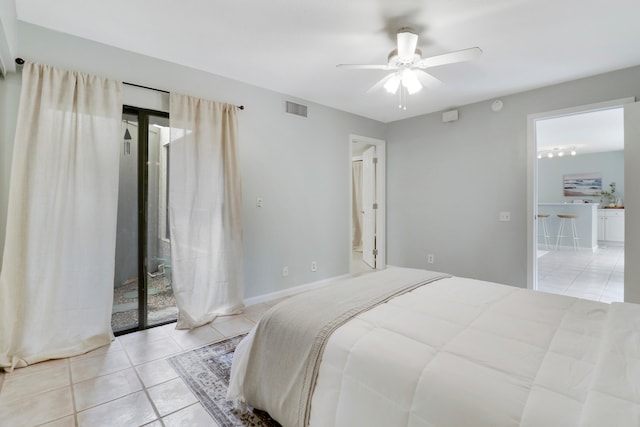 bedroom with light tile patterned floors, access to outside, ensuite bath, and ceiling fan