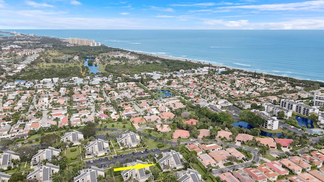 bird's eye view with a water view and a view of the beach