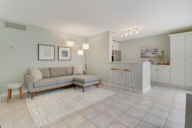 living room with light tile patterned floors