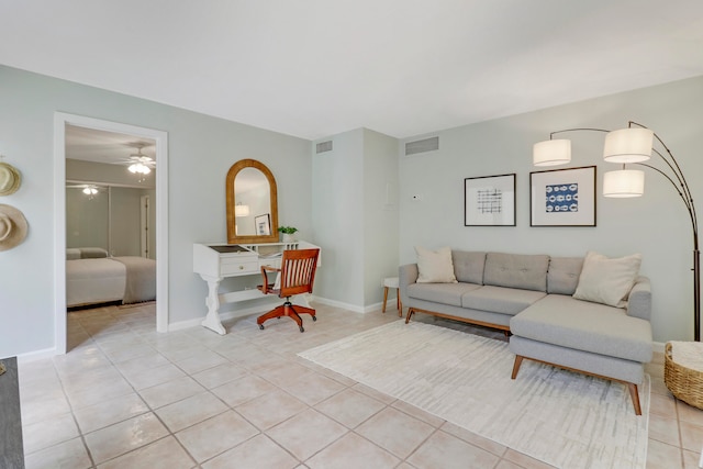 tiled living room featuring ceiling fan