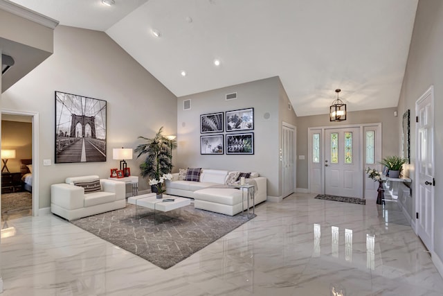 living room featuring ceiling fan with notable chandelier, plenty of natural light, high vaulted ceiling, and a textured ceiling