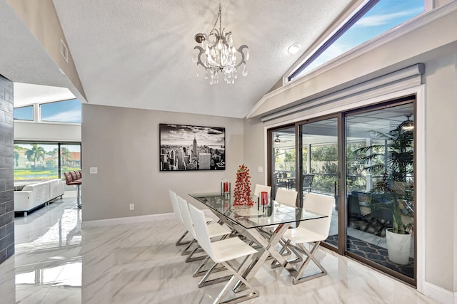 dining area with high vaulted ceiling, a textured ceiling, and a notable chandelier