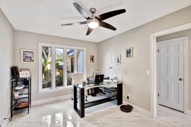 office featuring a textured ceiling and ceiling fan