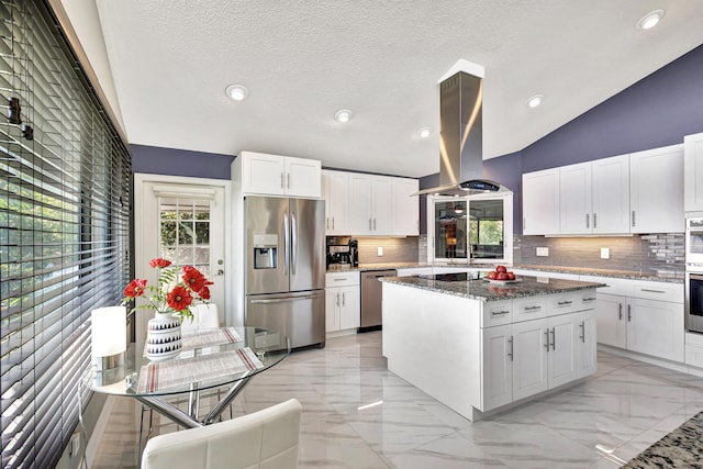 kitchen featuring sink, stainless steel fridge with ice dispenser, stone countertops, white cabinetry, and island exhaust hood