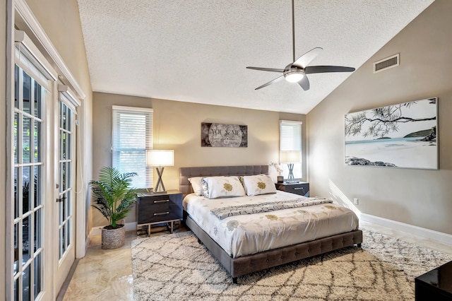 bedroom featuring multiple windows, a textured ceiling, high vaulted ceiling, and ceiling fan