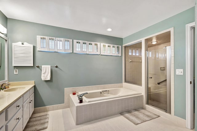 bathroom featuring tile patterned flooring, vanity, and plus walk in shower