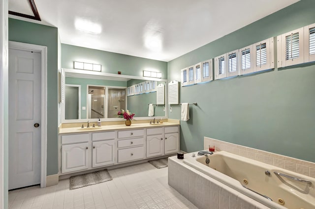 bathroom with vanity, tile patterned floors, and separate shower and tub