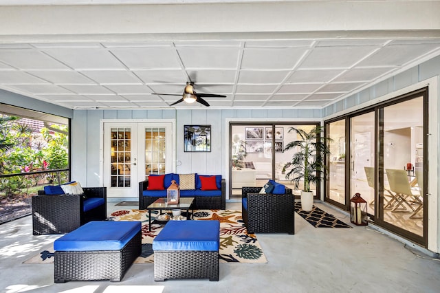 sunroom / solarium featuring ceiling fan and french doors