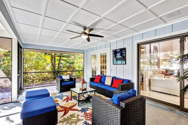 sunroom / solarium with ceiling fan and french doors