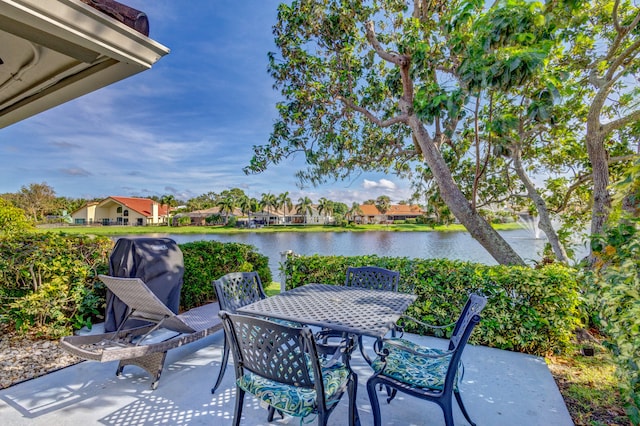 view of patio / terrace with a water view and grilling area