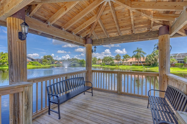 deck featuring a gazebo and a water view