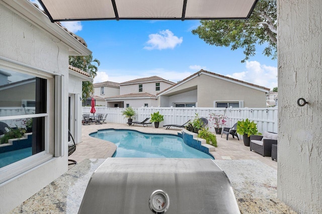 view of swimming pool featuring a patio