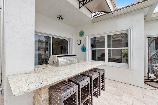 view of patio featuring exterior bar