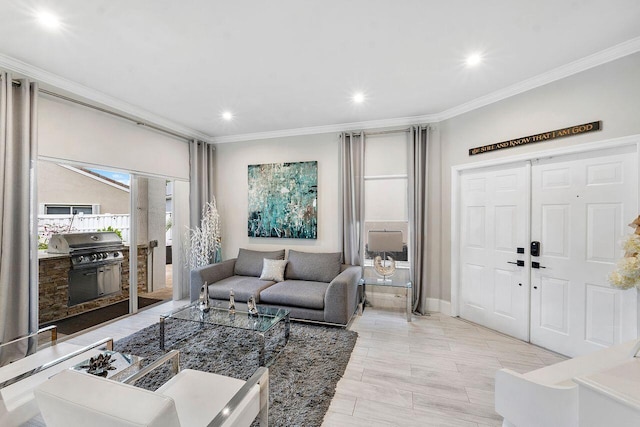 living room with light hardwood / wood-style floors and crown molding