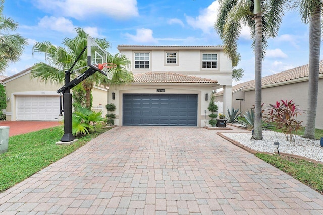 mediterranean / spanish-style house featuring a garage