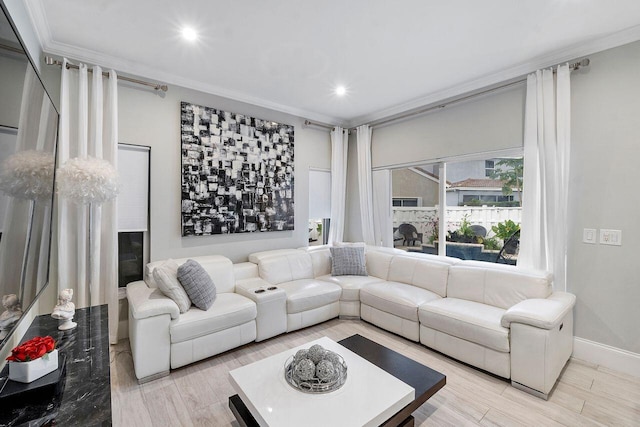 living room featuring light wood-type flooring and ornamental molding