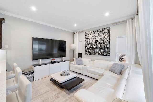 living room featuring light hardwood / wood-style floors and crown molding