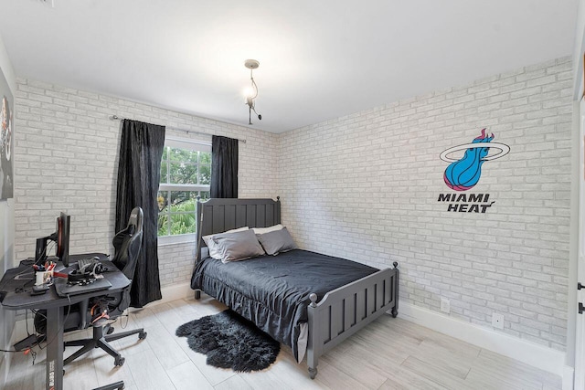 bedroom with brick wall