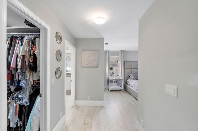 hall with light hardwood / wood-style flooring