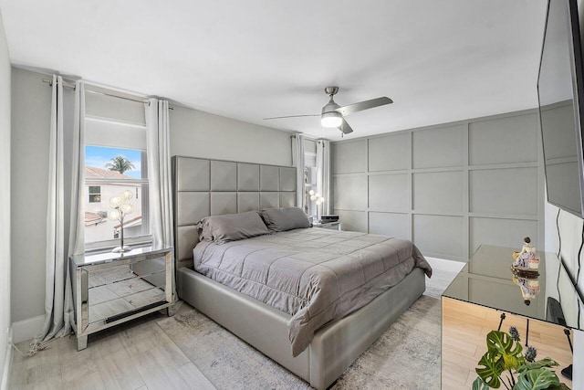 bedroom featuring light hardwood / wood-style flooring and ceiling fan