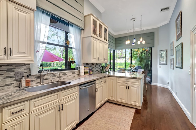 kitchen with dishwasher, a healthy amount of sunlight, decorative light fixtures, and sink