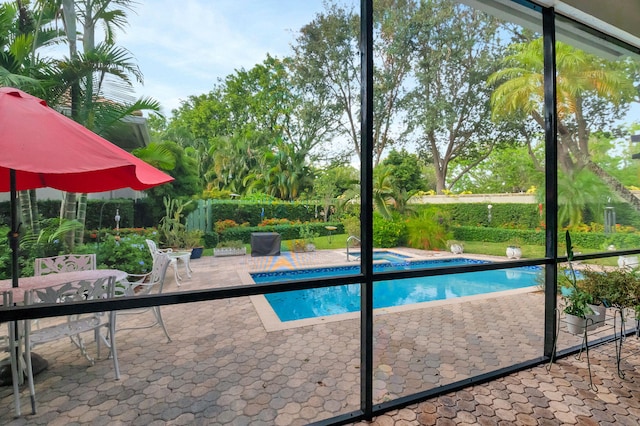 view of pool featuring an in ground hot tub and a patio area