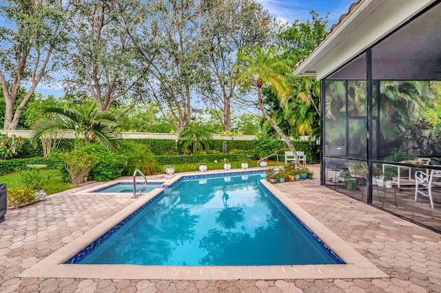 view of pool featuring a patio area