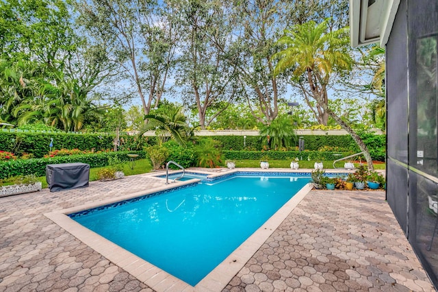 view of swimming pool featuring a patio