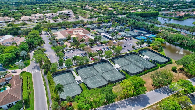 birds eye view of property with a water view